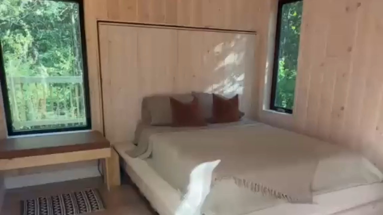 Nordic Pines Aurora bedroom before the bed rolls out toward the forest